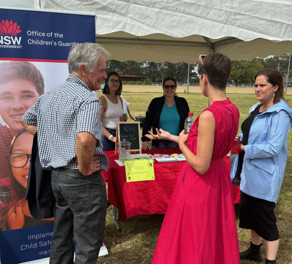 Adults talking at a picnic